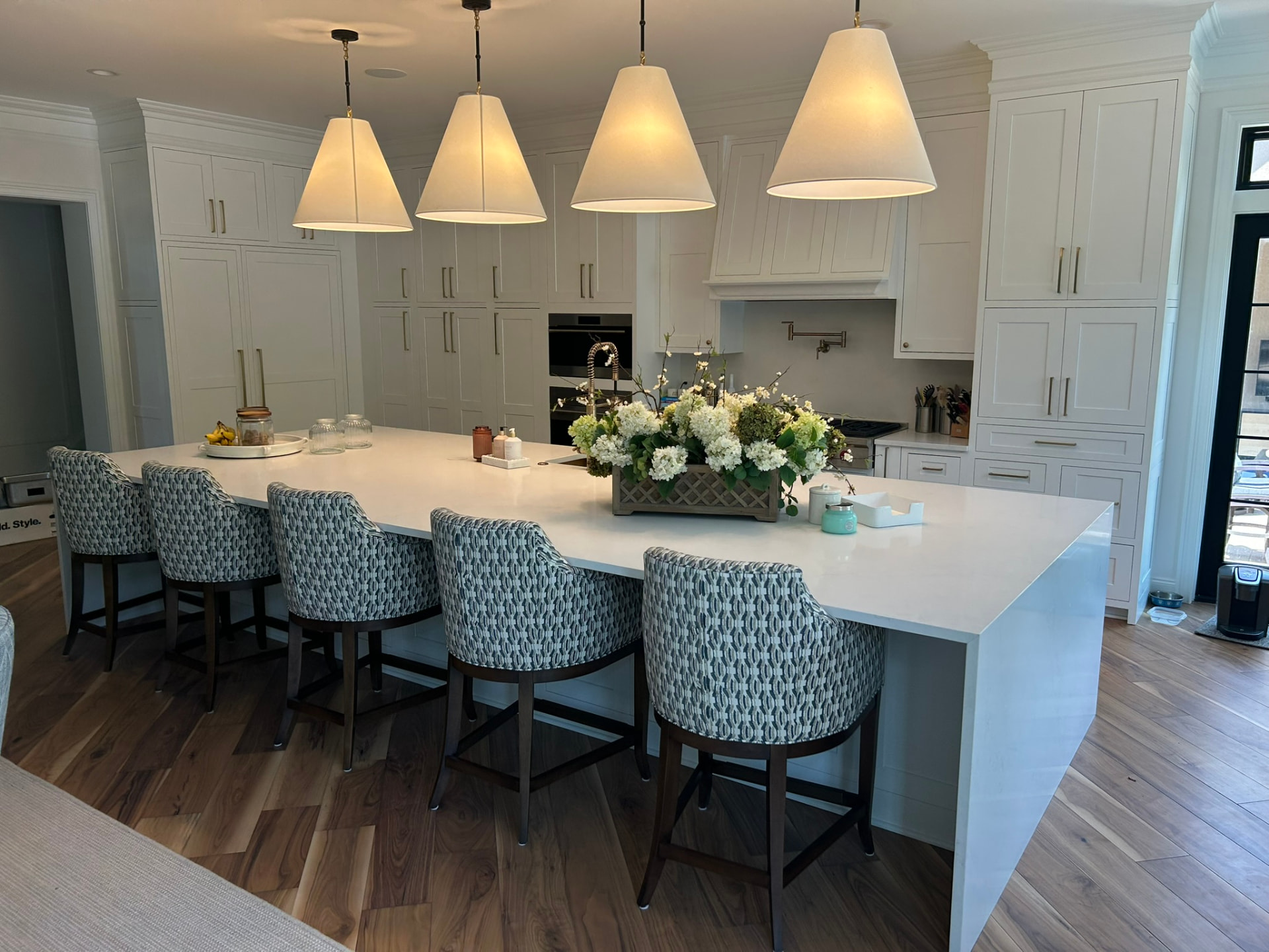 White quartz waterfall kitchen island installed by Aceno in the Quad Cities
